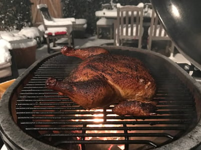 Chicken cooking on primo grill
